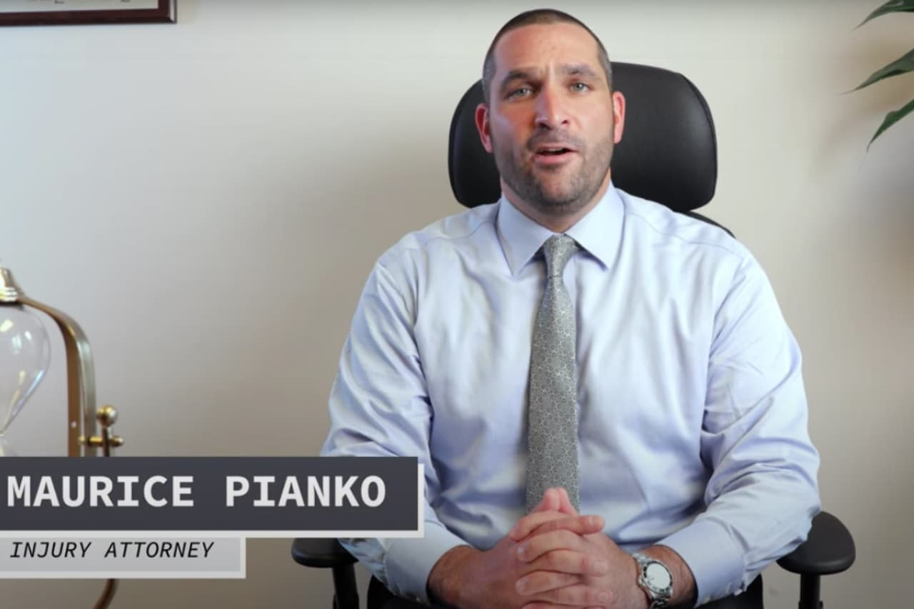 Maurice Pianko of Pianko Law Sitting at His Desk